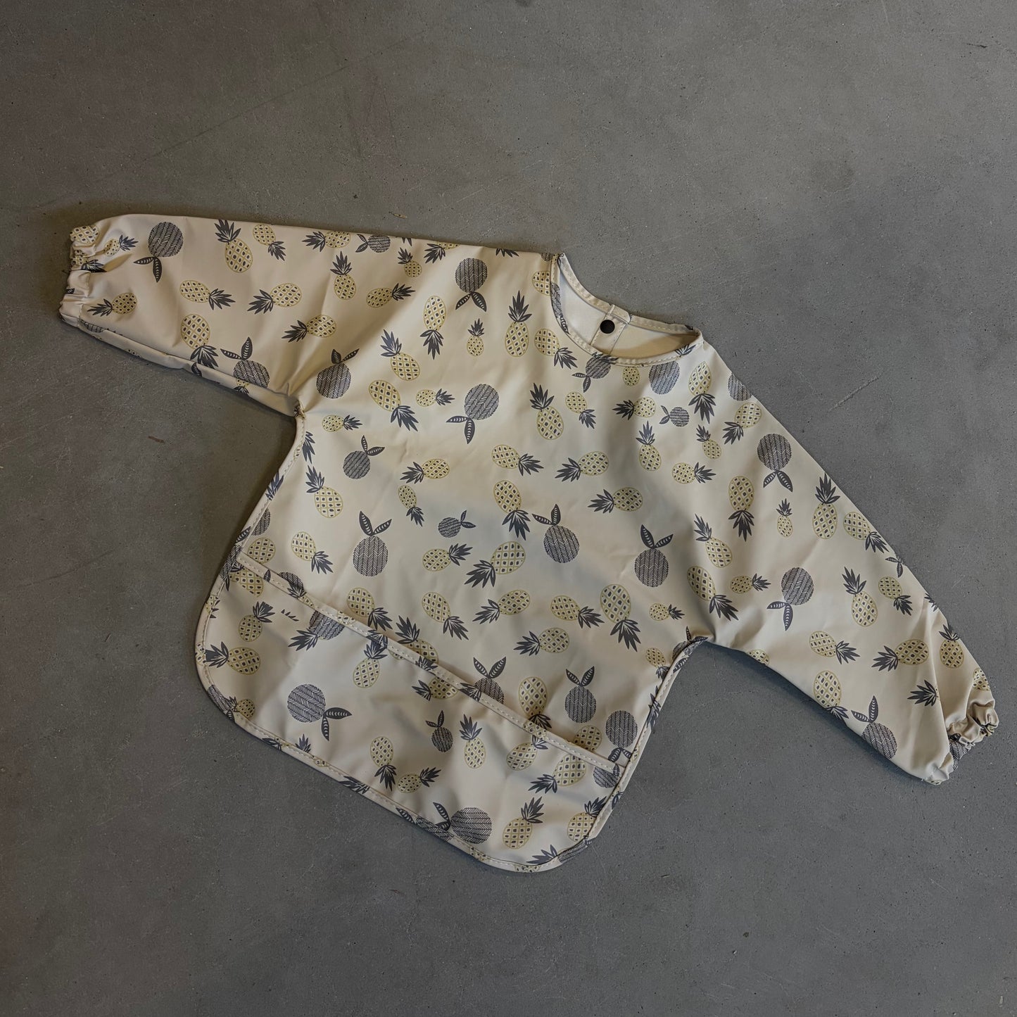 Waterproof slab met mouwen – verstelbaar (0–4 jaar) ananas