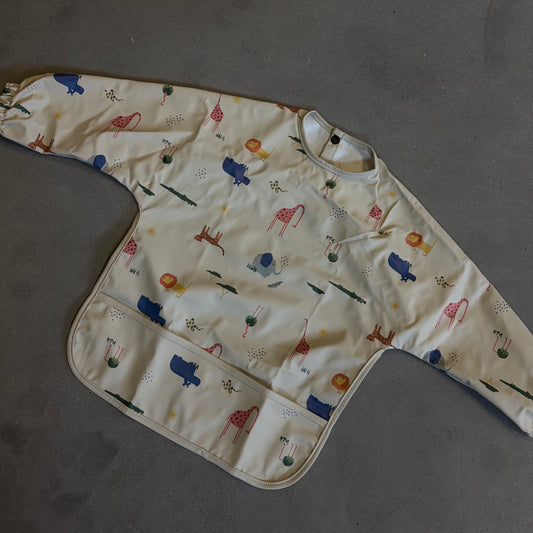 Waterproof slab met mouwen – verstelbaar (0–4 jaar) flamingo