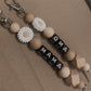 Sleutelhanger | Bloem wit & zwarte letters
